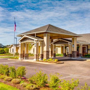 Community building entrance with modern architecture. Arbor Oaks Terrace, Assisted Living and Memory Care in Newberg, Oregon