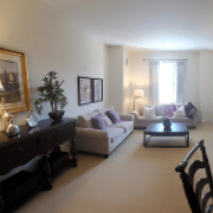 living room with couch, coffee table and window