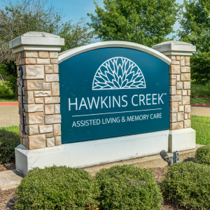 sign outside of community that says hawkins creek
