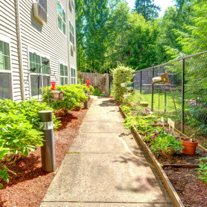 walking path by garden at community
