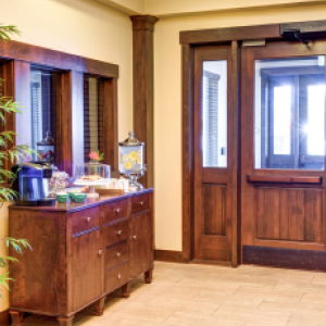 entry way with dresser and large doors
