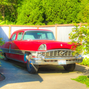 red car parked in a driveway