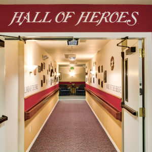 hallway with a sign above it that says hall of heroes