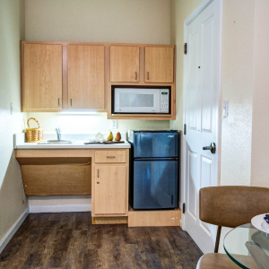 kitchen with mini fridge and cabinets