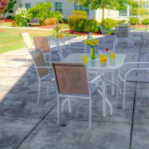 outdoor patio with table and chairs in the shade