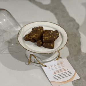 Delicious chocolate on a plate, sprinkled with edible gold.