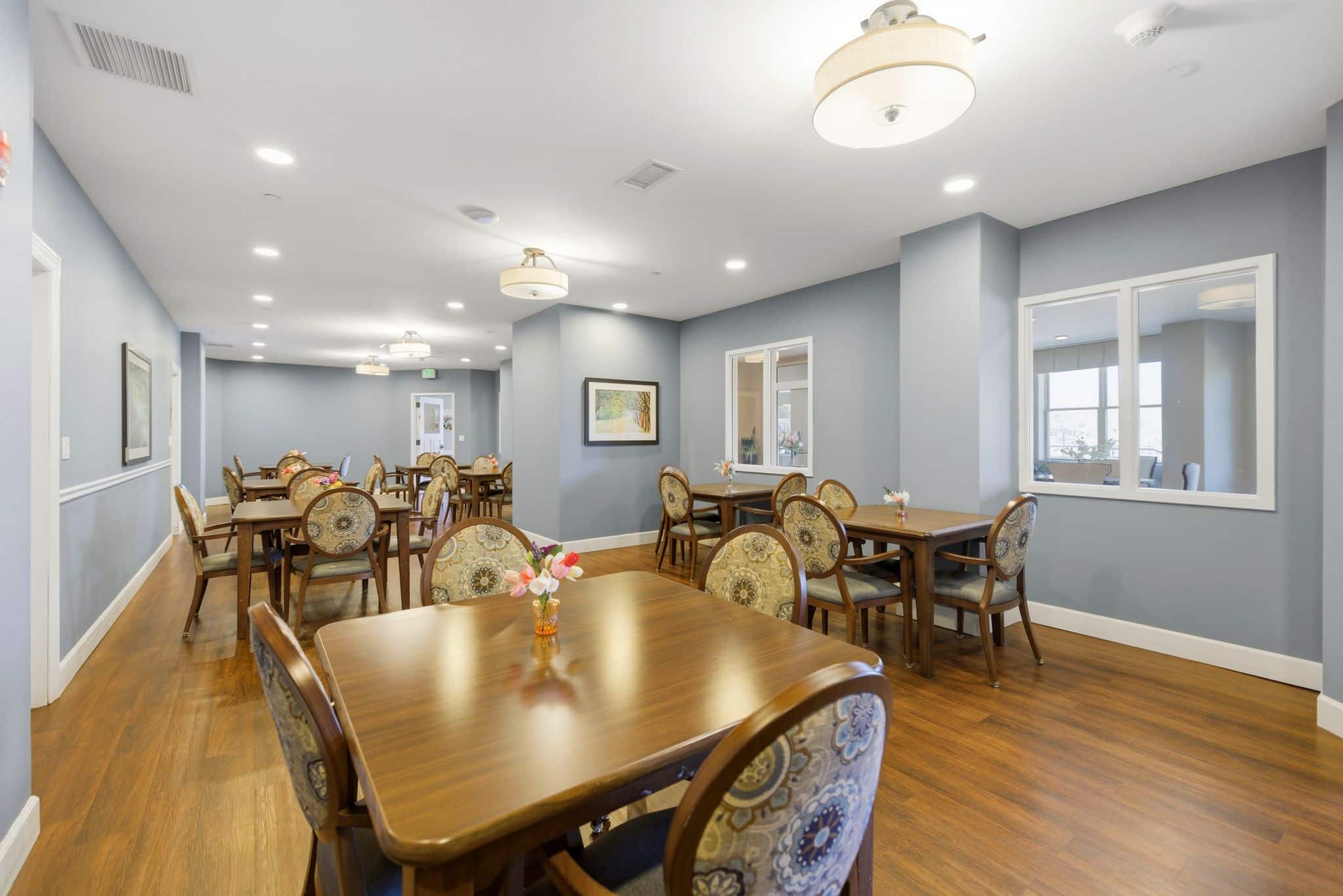 A restaurant dining room with multiple tables.