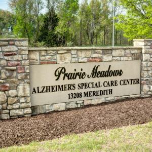 sign outside of community that says prairie meadows