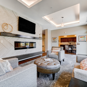 lounging area inside community with couches and television
