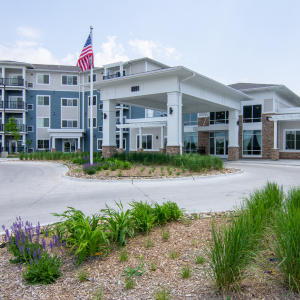 Step inside the senior living community building through its inviting entrance.