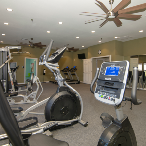 Gym inside the community with a variety of exercise equipment