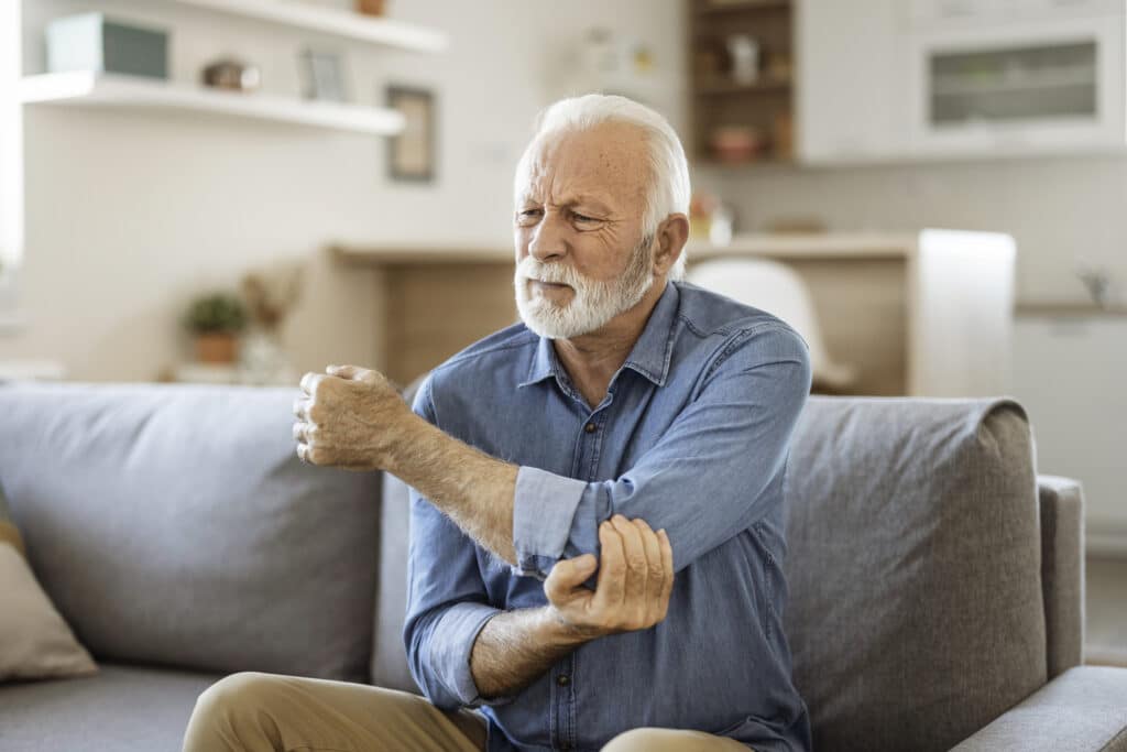 Senior man with Elbow pain.