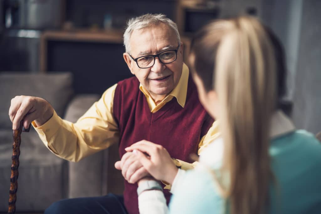 Home doctor is visiting senior man to check his health