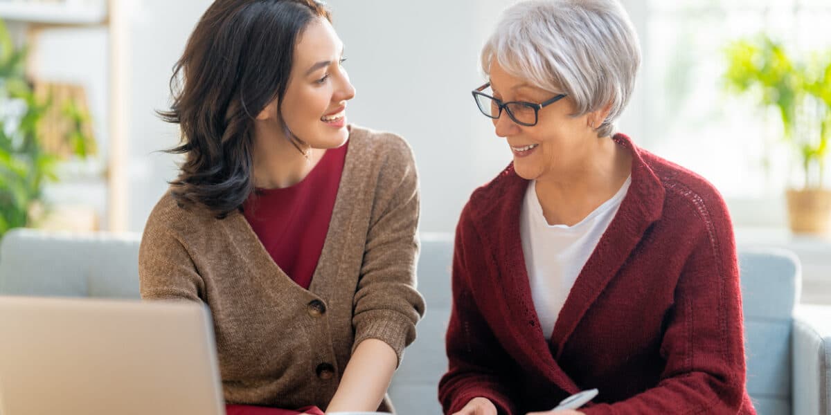 Elderly woman learning how to manage financials