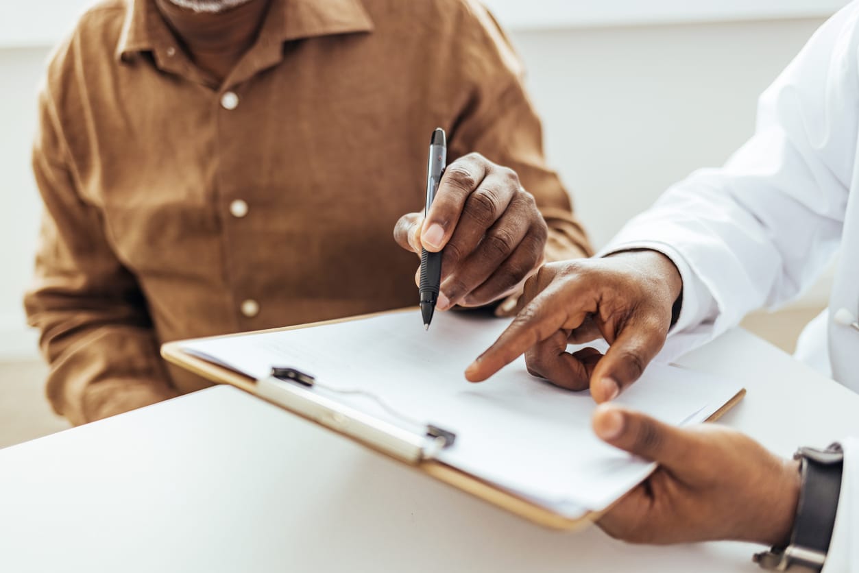 Retired man sign health care service contract