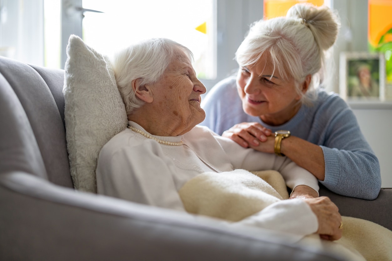 Elderly woman being taken care of