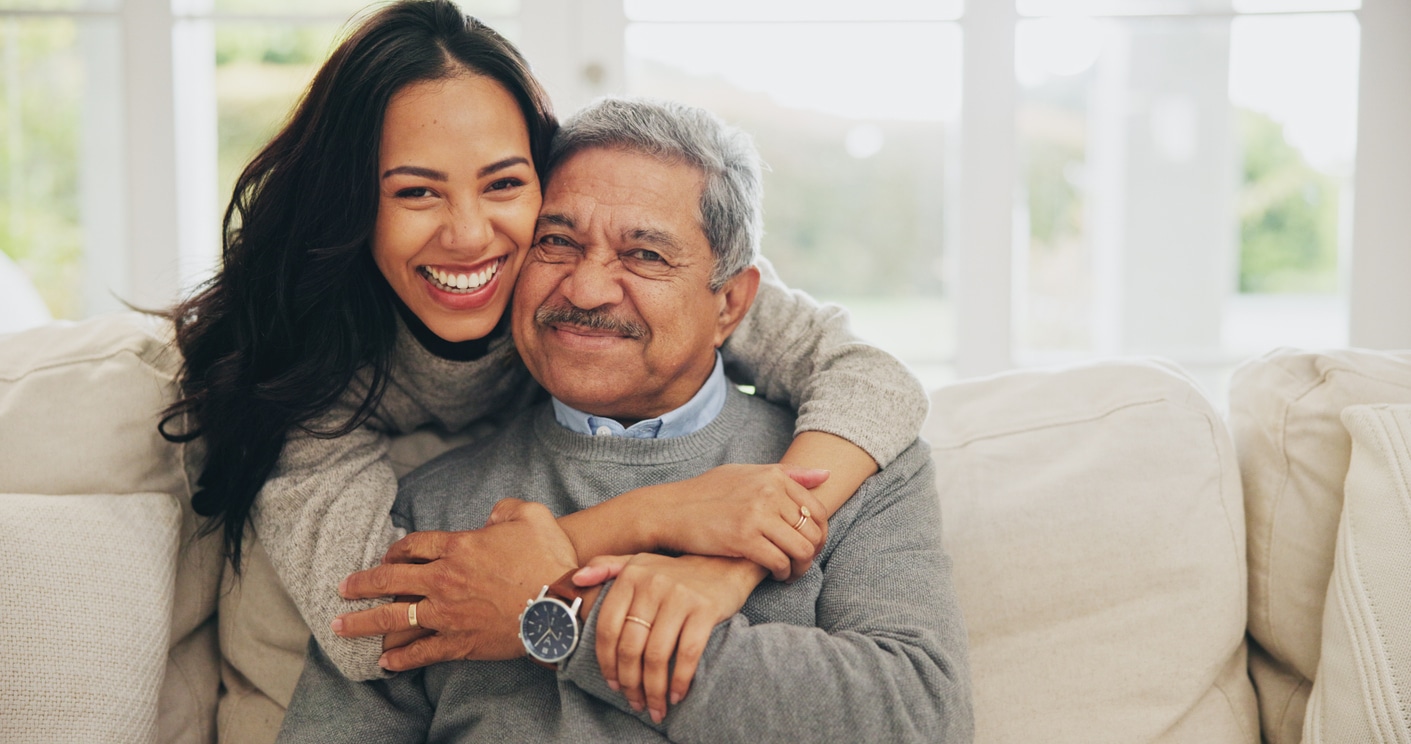 Elderly man hugging his daughter