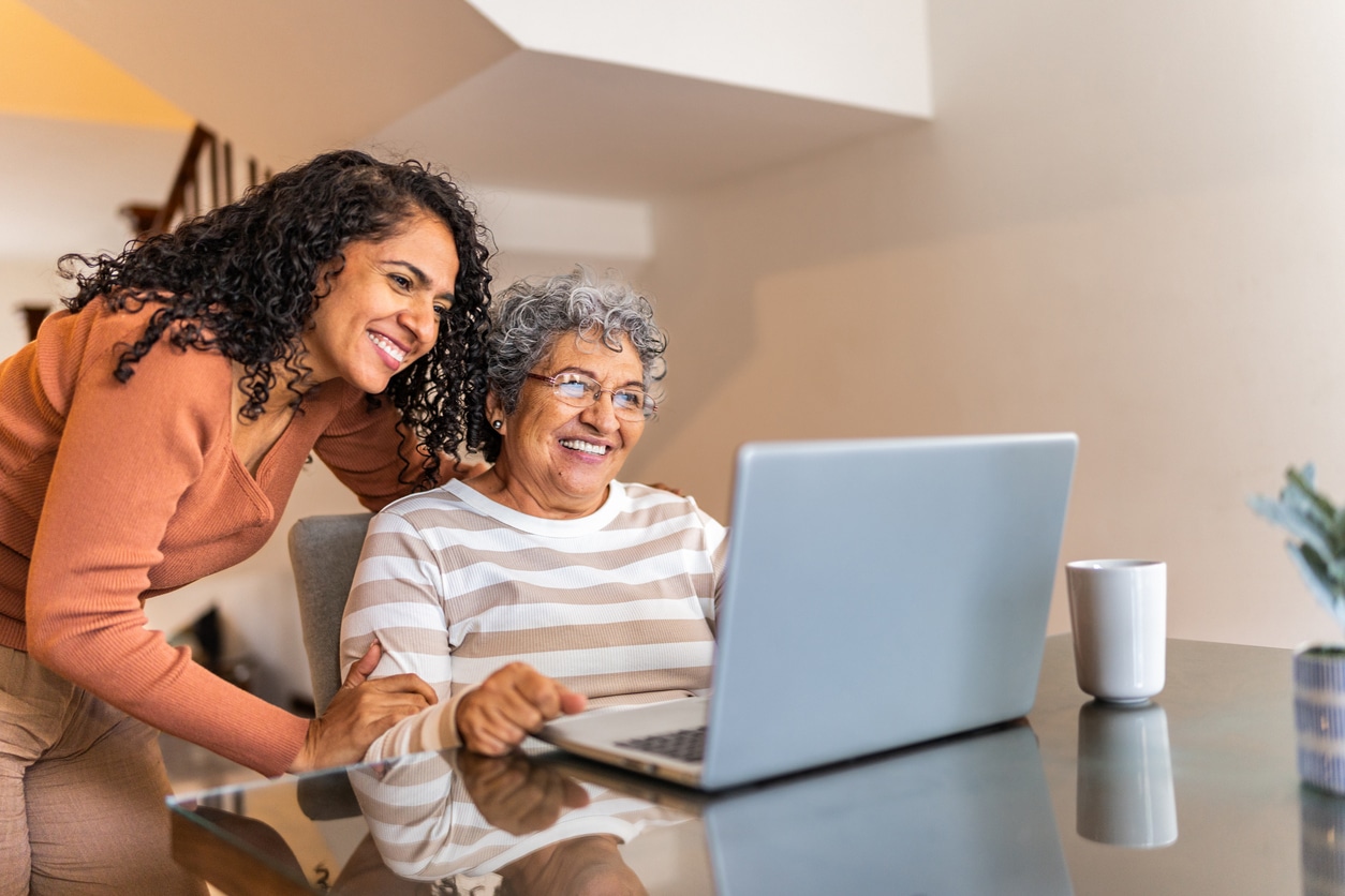 Senior woman looking something up on her computer