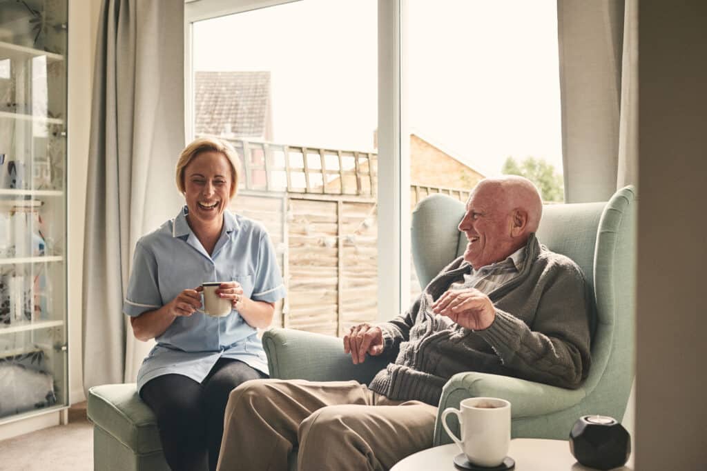 Senior man and female career enjoying coffee at home