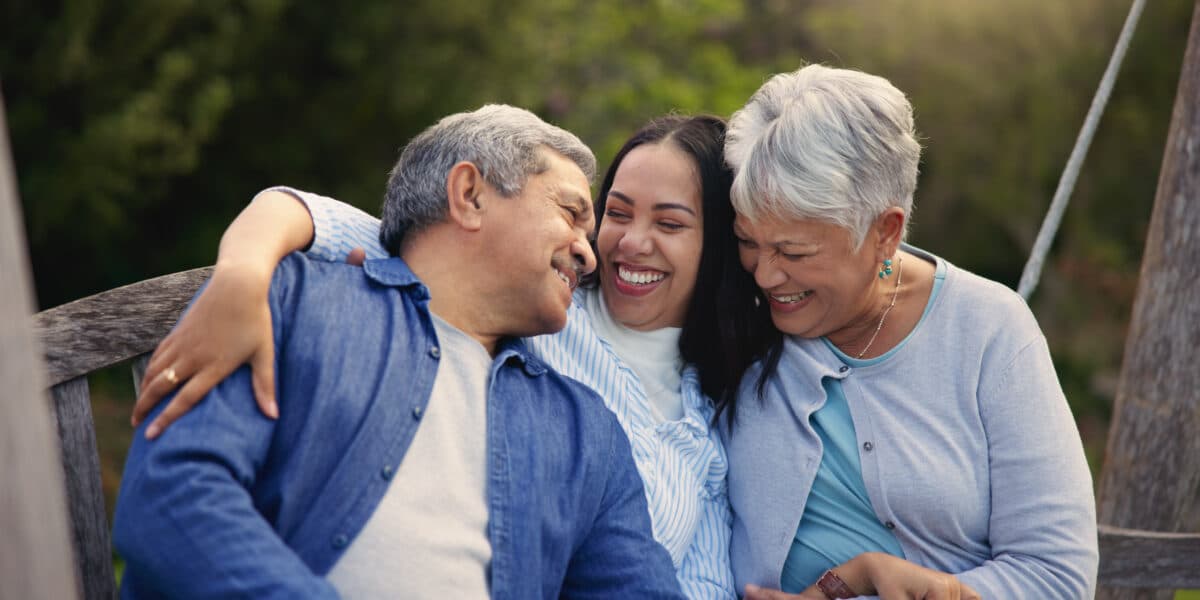 Happy family, senior parents or woman on bench in nature, hug or bonding in smile on retirement.
