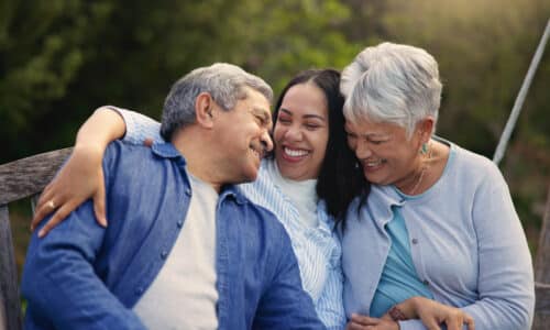 Happy family, senior parents or woman on bench in nature, hug or bonding in smile on retirement.