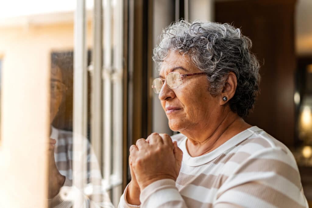 Senior woman contemplating at home