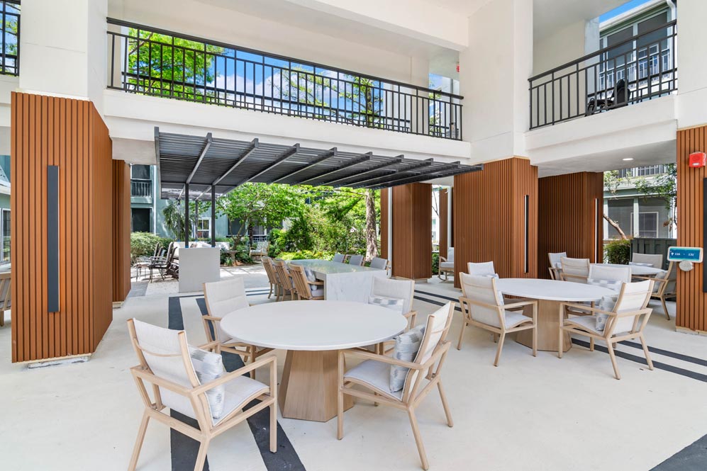 Outdoor patio with tables and chairs